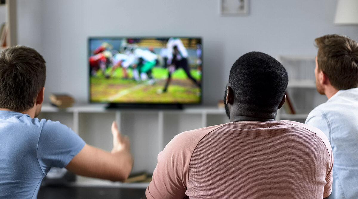 fans watching football on tv