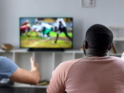 fans watching football on tv