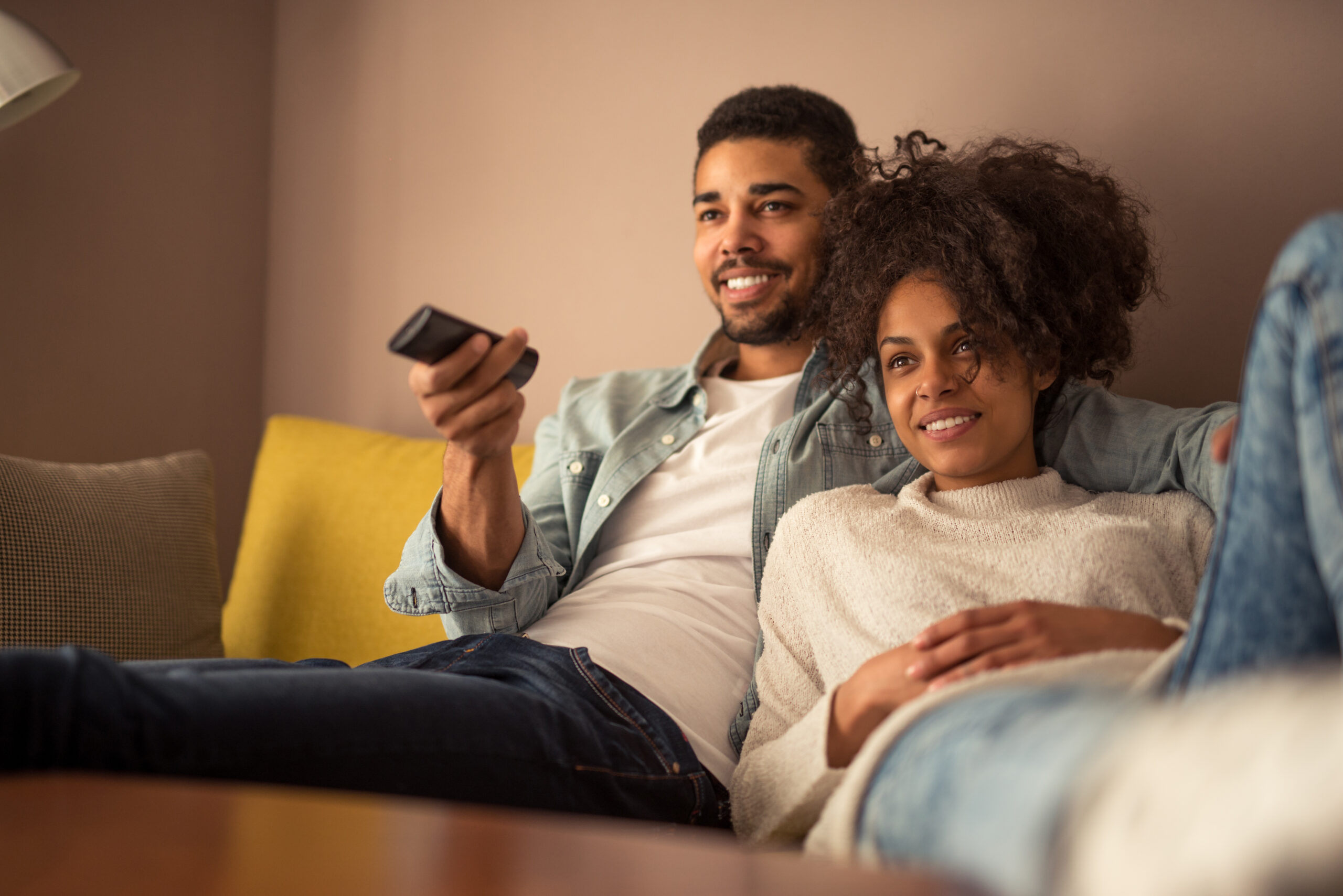Cropped,Shot,Of,A,Young,African,American,Couple,Watching,Television
